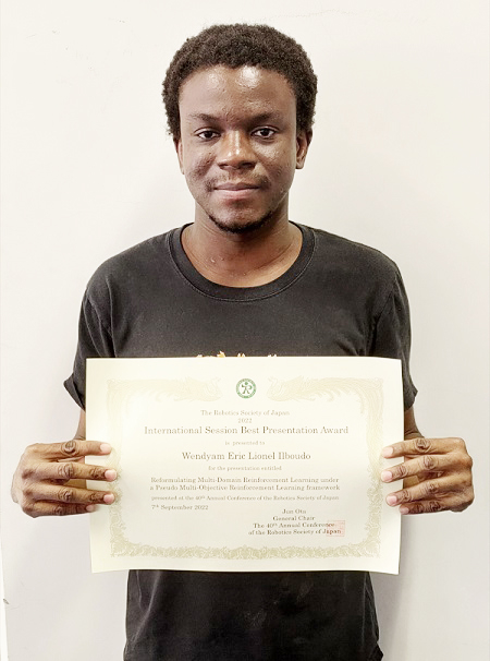 Wendyam Eric Lionel Ilboudo (Robot Learning Lab) receives the International Session Best Presentation Award.