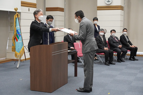 Graduates receiving their diploma.